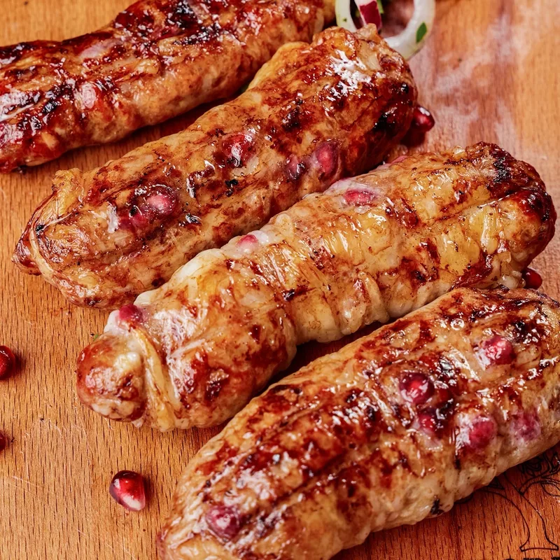 Люля из говядины в жировой сетке с гранатом